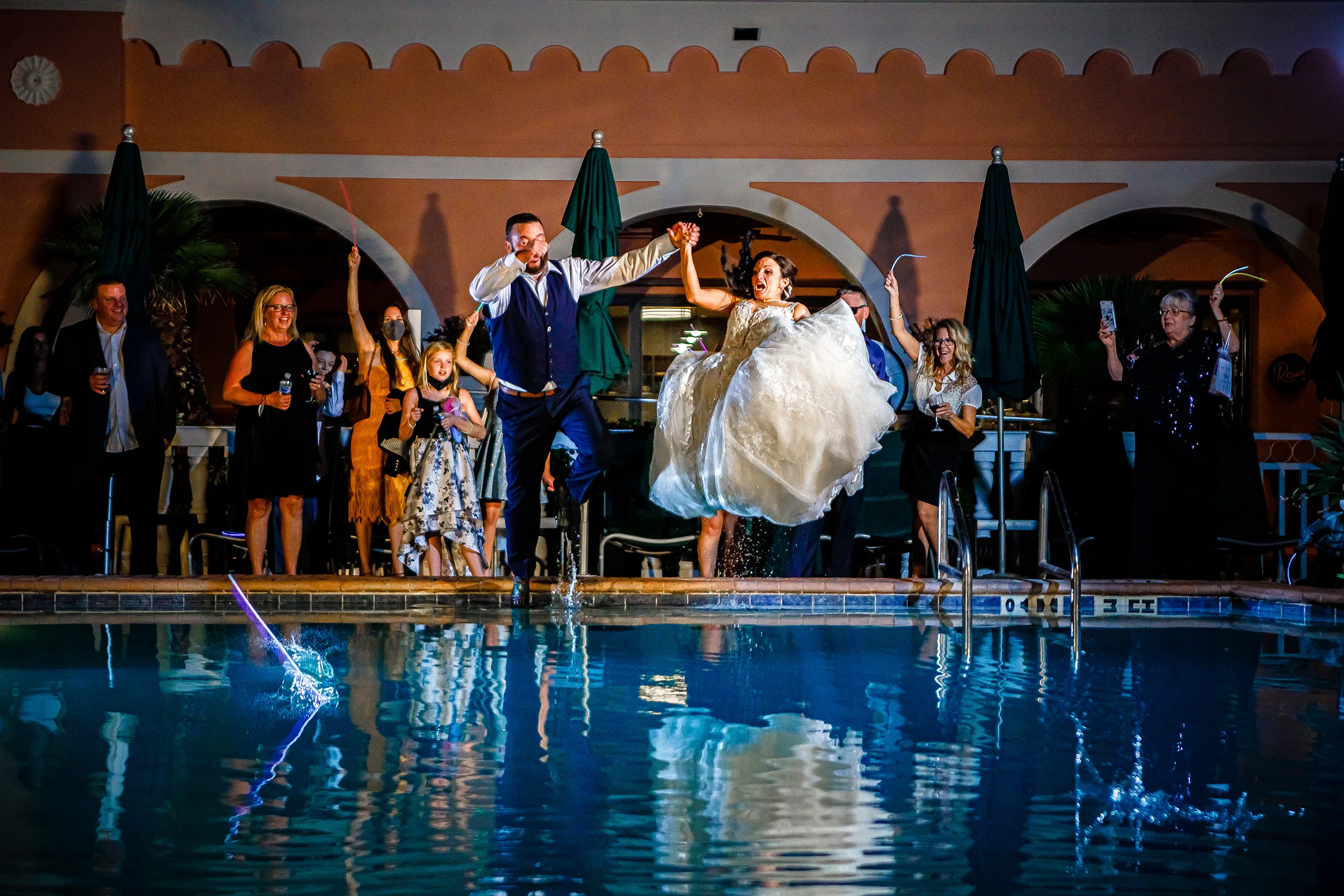 Bride and Groom Jumping into Pool at Wedding Tampa Events Done Right