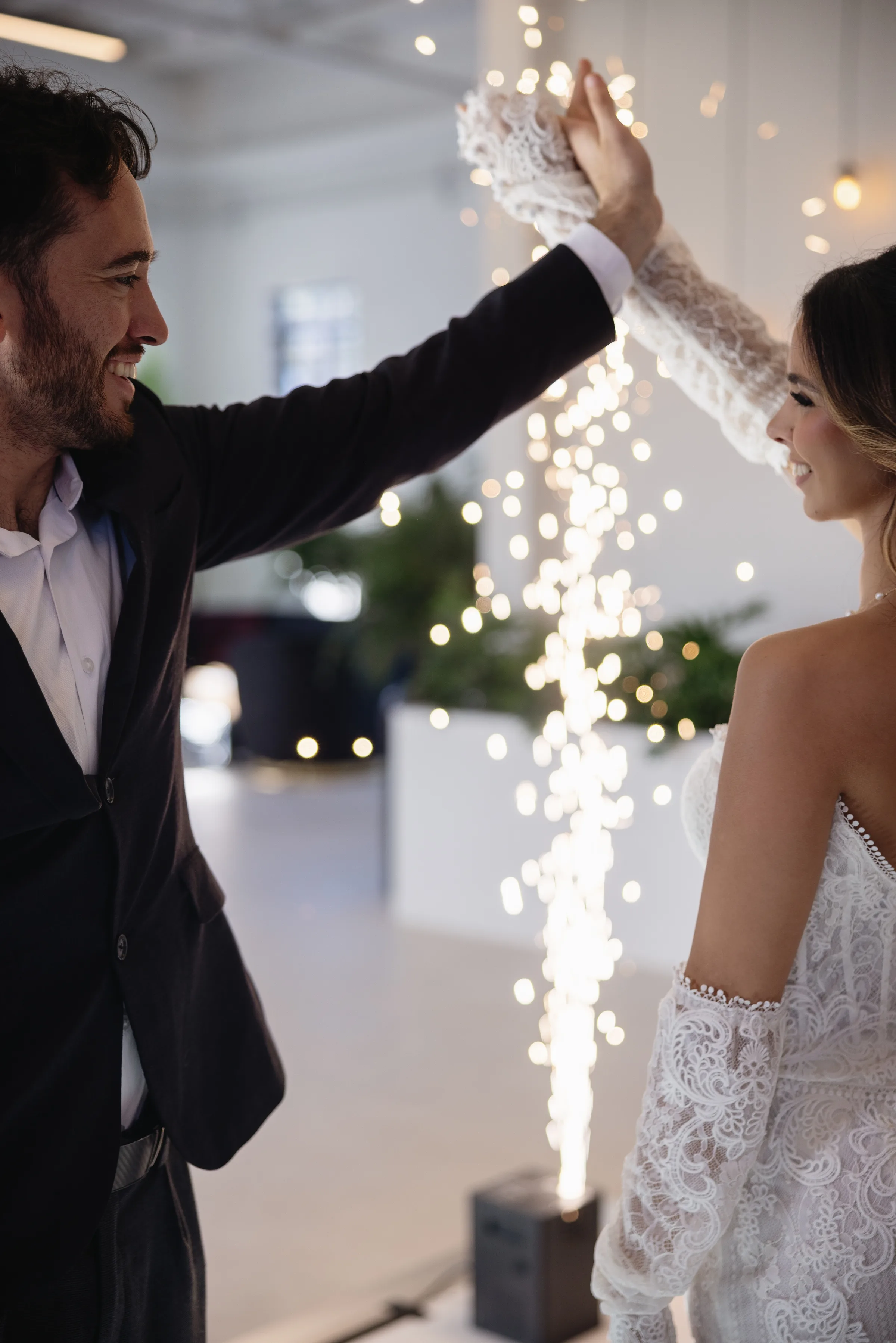 Events Done Right Tampa Bay DJ Event Ehancements Cold Sparks behind bride and groom photo by Arianna J Photography 1